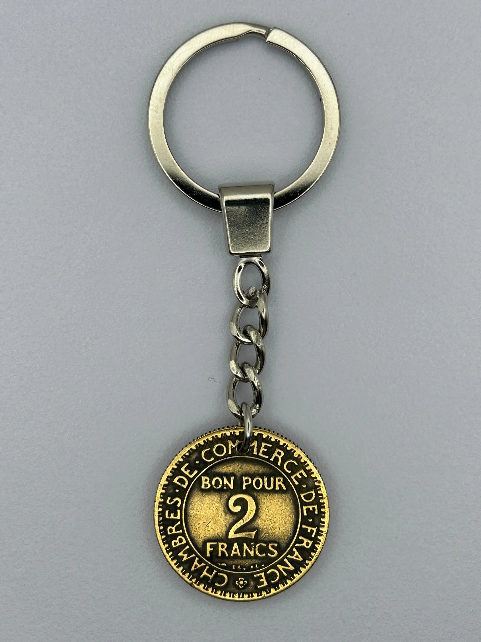 Porte-clés en pièce de monnaie 2 francs Chambre de Commerce, unique et artisanal.
